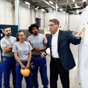 business owner talking to employees
